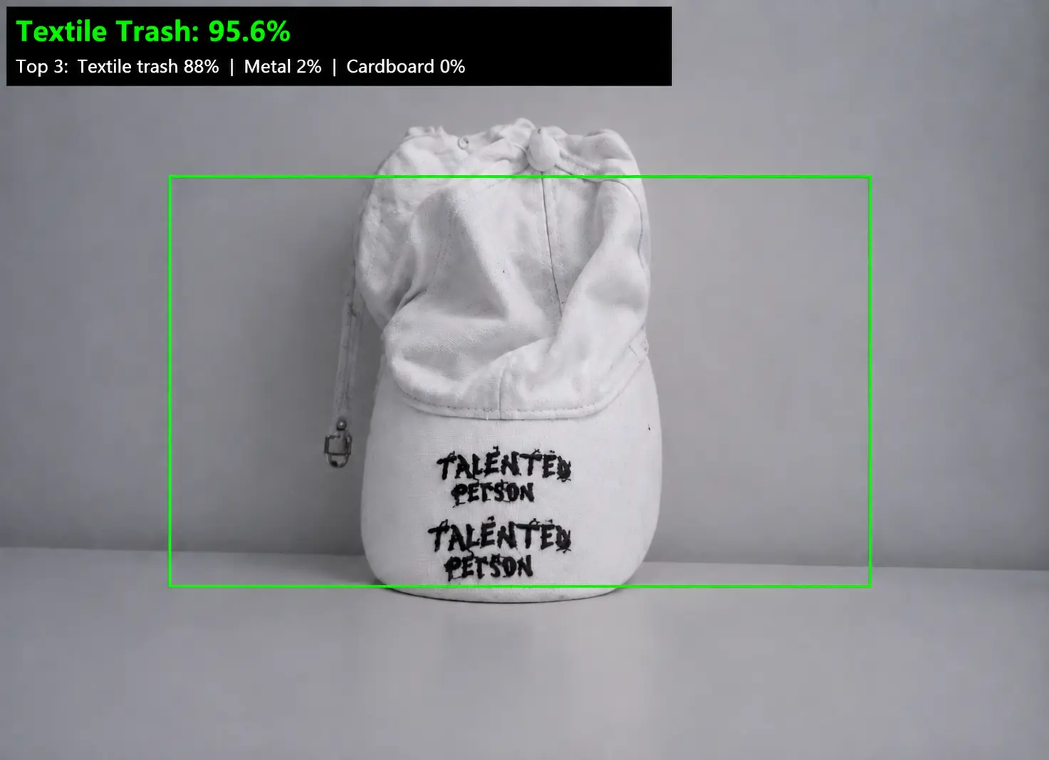 Classifier identifying a white cap as textile trash with 95.6 percent confidence